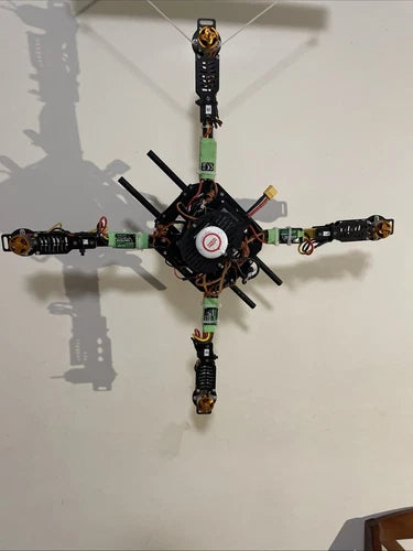 DJI quadcopter drone frame with four arms and exposed propellers