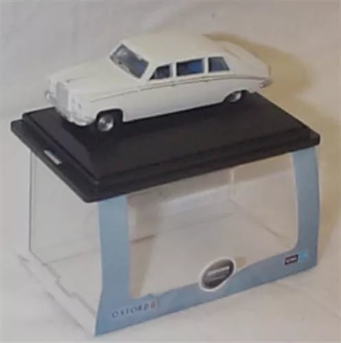 White OO scale diecast model car with black base on display box