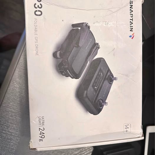 Drone box with front and top view of drone printed on it