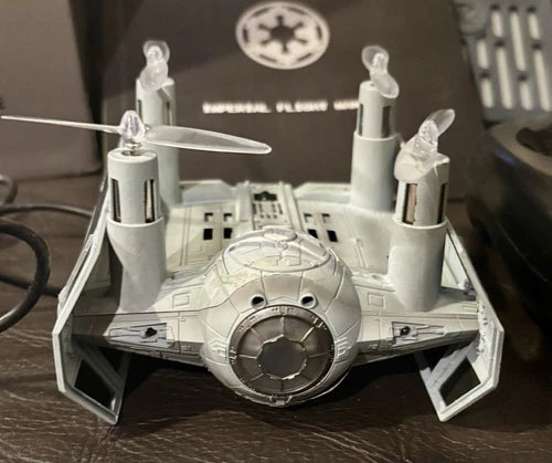 High-performance battling drone toy with gray starfighter body and wing pods