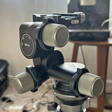 Geared 3-way tripod head with two ribbed adjustment knobs, black metal