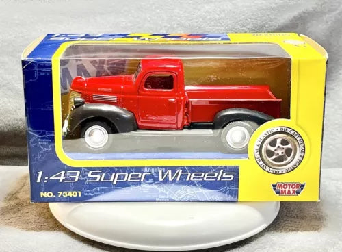 Red diecast pickup truck in retail box, 1:43 scale