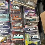 Diecast car sets in retail blister packaging, mixed police and vintage cars