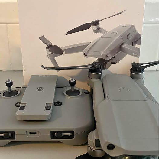 DJI Mavic Air 2 Quincy FL drone with gray controller and folded propeller arms