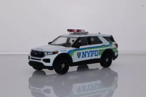 Diecast police SUV toy car in white with NYPD and blue striping, front 3/4 view