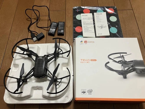 Tello EDU mini drone with controller, battery, and cables in a foam tray