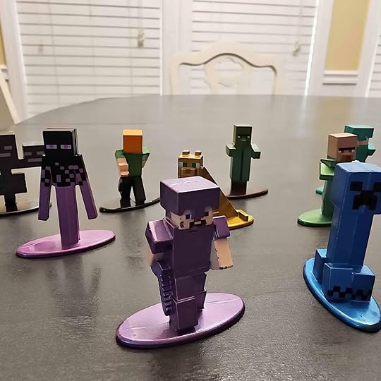 Diecast Minecraft-style figure set with multiple blocky characters on round bases