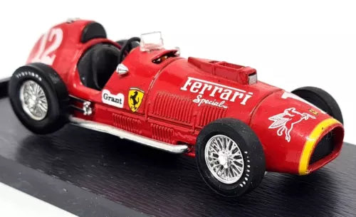 Red diecast racing car model with Ferrari logo and yellow stripe, open-wheel design