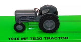 Grey 1940s-style diecast tractor model with black tires, front view
