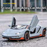 Alloy diecast sport car model with scissor doors, white body and orange trim.