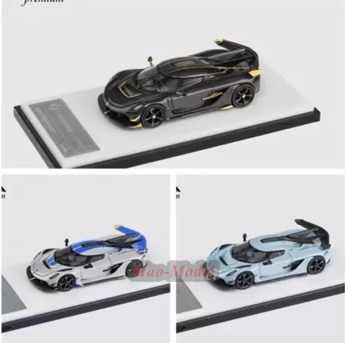 Diecast alloy car model, dark gray with gold details, on display base