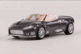 1/64 scale diecast sports car, black with silver wheels and chrome front grille