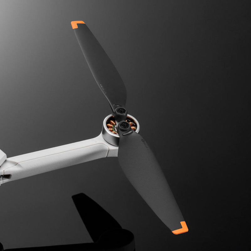 Drone propeller replacement set with three blades and orange tips, center hub