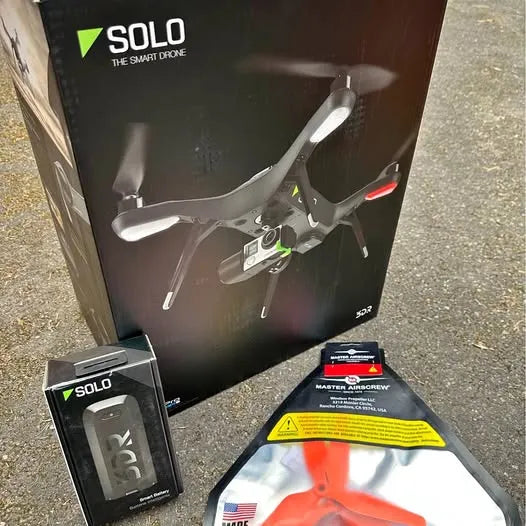 3DR SOLO smart drone and accessories in retail packaging, shown opened