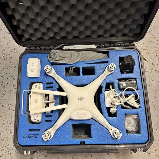 DJI Phantom 4 Pro drone with accessories in foam-lined case, white quadcopter body