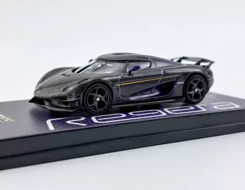 Diecast sports car model, dark purple/black with neon purple stripe details and black wheels