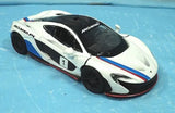White McLaren P1 1/36 diecast model car with black hood and pull-back action