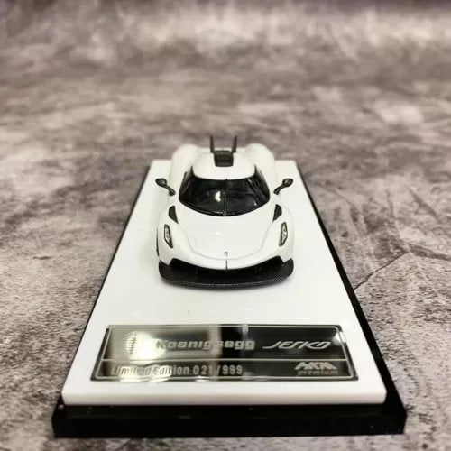 1:64 alloy diecast supercar model on display base, white with black accents