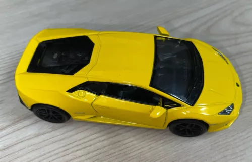 Yellow Lamborghini Huracan LP610-4 diecast car toy, 1/36 scale, side view