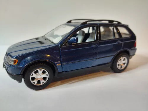 Blue diecast SUV model, 1:36 scale, side view with silver wheels