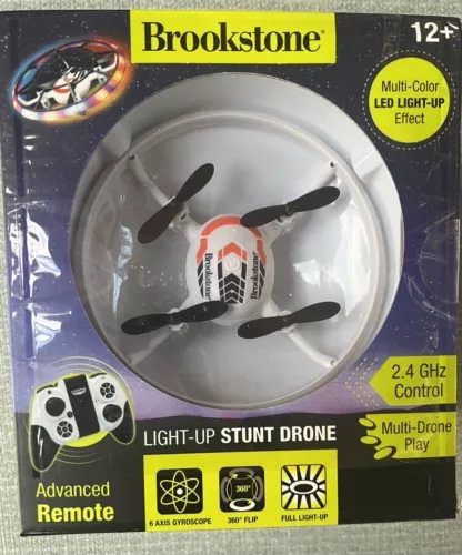 Brookstone light-up stunt drone with 2.4 GHz remote control and multi-color LED lights