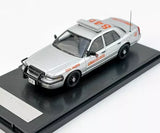 Light gray police patrol diecast car model with roof lights, front 3/4 view
