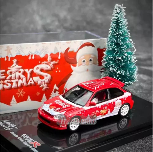 Red diecast car model with festive decals, front three-quarter view, white wheels