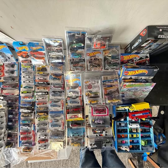 Hot Wheels diecast car set with multiple blister-packed cars on display