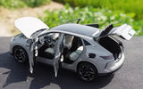 1/18 scale grey diecast SUV model with open doors and black interior