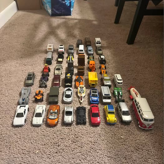 Diecast car lot of assorted Hot Wheels toy cars in various colors and styles