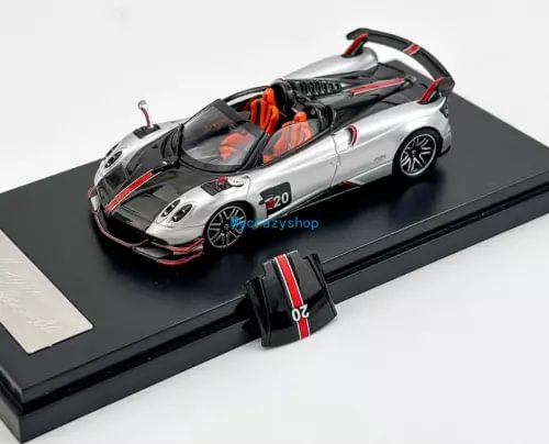 Silver sports diecast model car with black hood, red accents, and #20 graphic