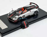 Silver sports diecast model car with black hood, red accents, and #20 graphic