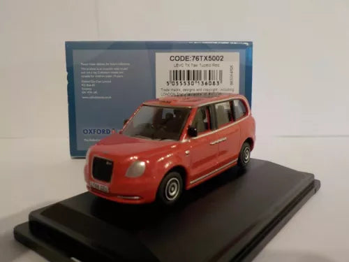 LEVC red diecast taxi model on display base, front view