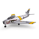 Silver and yellow RC jet airplane model with swept wings and checkered tail