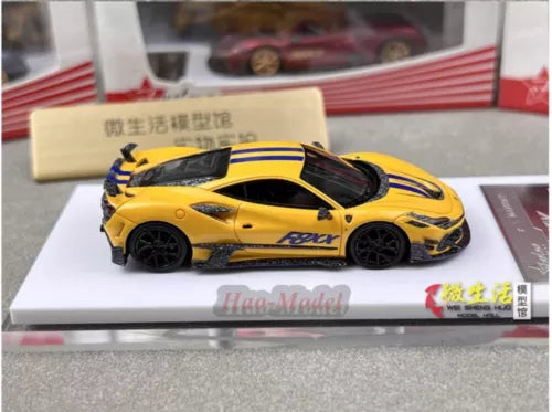 Yellow and black resin diecast supercar model car on display base