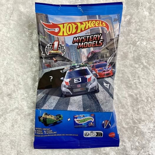 Hot Wheels Mystery Models diecast car in blue blister package, front view with two mini cars