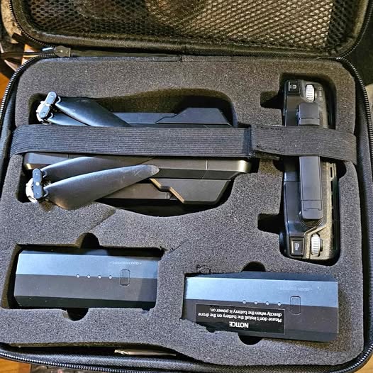 Drone accessories set in molded hard case, including drone and battery modules