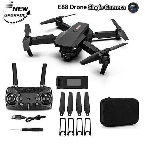 Black quadcopter drone with single camera, controller, batteries and propeller accessories set