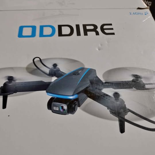 Gray foldable quadcopter drone with blue stripe and front HD camera