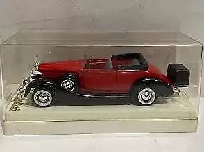 Red convertible 1:43 diecast model car with black wheels