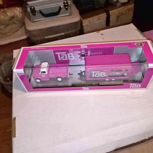 Diecast model truck set in pink retail box with clear window