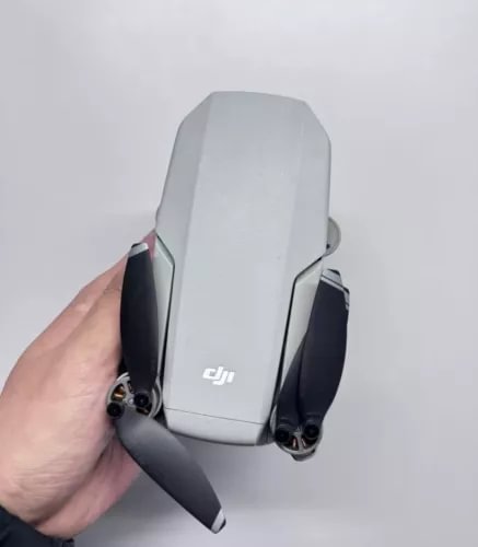 DJI Mini 1 drone with folded propellers, white body and gray arms