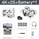 White mini quadcopter RC drone with four propellers and remote controller