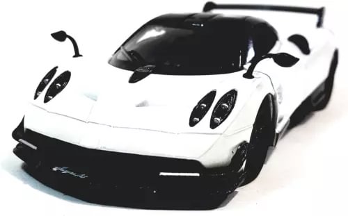 White and black Pagani diecast model toy car, front three-quarter view