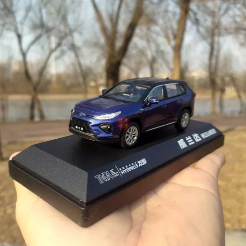 Diecast model SUV car in blue with display base