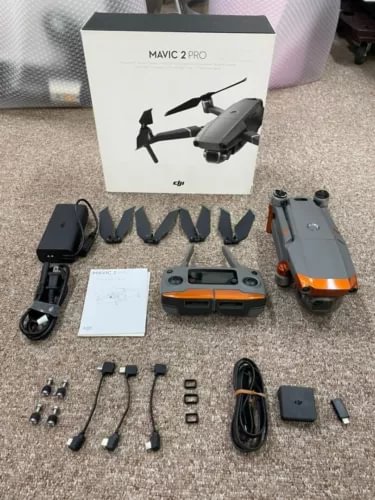 DJI Mavic 2 Pro drone with controller, spare propellers, cables, and accessories