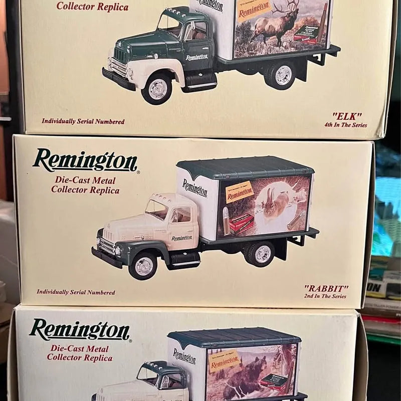 Remington die-cast metal collector truck replicas in retail boxes, visible front and side.