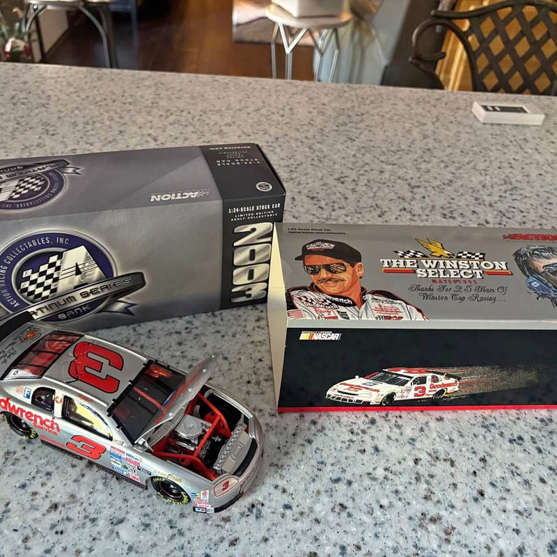 Winston Select diecast race car bank with clear window, red and silver body on display box