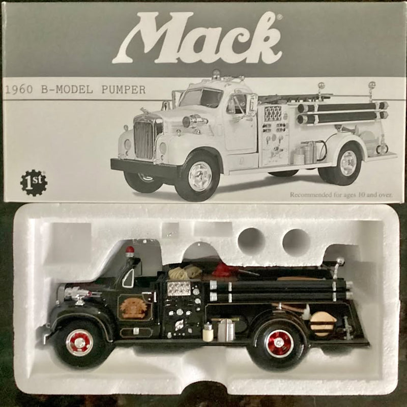 White diecast fire truck model with extended ladder and front grille details