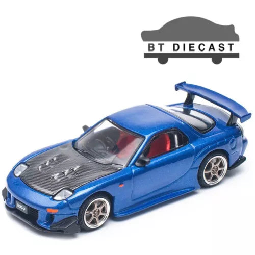 Blue 1/64 diecast race car model with rear spoiler and detailed wheels